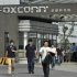 Workers walk out of the entrance to a Foxconn factory in Chengdu