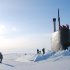 In this March 19, 2011 photo released by the U.S. Navy, crew members look out from the USS Connecticut, a Sea Wolf-class nuclear submarine, after it surfaced through ice in the Arctic Ocean. The U.S. and other countries are building up their military presence in the Arctic to help exploit its riches - and protect shifting borders.  (AP Photo/U.S. Navy, Cmdr. Christy Hagen)