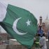 Workers hang a Pakistani national flag on a flagpole as part of preparations for the Independence Day celebrations at Pakistani monument or Minar-e-Pakistan in Lahore, Pakistan on Saturday, Aug. 13, 2011. Pakistan will celebrate its 64th Independence Day on Aug. 14, to mark its independence from the British rule in 1947. (AP Photo/K.M. Chaudary)
