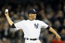 Injured New York Yankees closer Rivera throws out the ceremonial first pitch before Game 3 of the MLB ALDS baseball playoff series between the Yankees and the Baltimore Orioles in New York