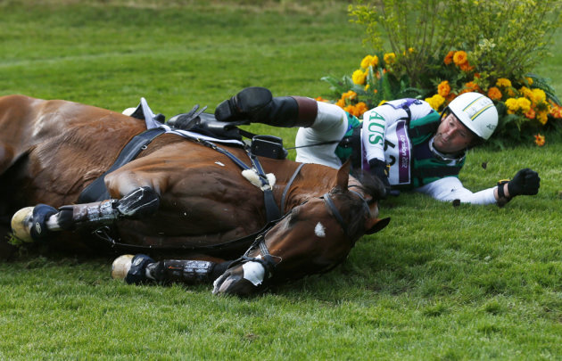 Australia&#39;s Clayton Fredericks lays as he felt down while competing in the Eventing Cross Country equestrian event at the London 2012 Olympic Games in Greenwich Park