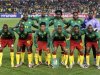 Cameroon's national soccer team pose for a photo during a 2010 World Cup Group E soccer match against Denmark in Pretoria