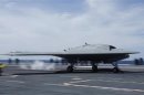 An X-47B pilot-less drone combat aircraft is launched for the first time off an aircraft carrier, the USS George H. W. Bush, in the Atlantic Ocean off the coast of Virginia