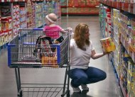 A customer shops in the expanded baby department at a remodelled Sam's Club in Rogers, Arkansas June 3, 2010.       REUTERS/Sarah Conard