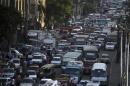 Cars are stuck in a traffic jam in downtown Cairo