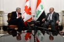 Canadian Prime Minister Stephen Harper, left, meets with his Iraqi counterpart Haydar al-Abadi at the Presidential Palace in Baghdad, on Saturday, May 2, 2015. (Sean Kilpatrick/The Canadian Press via AP) MANDATORY CREDIT