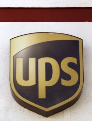 <p>               FILE - This Jan. 30, 2012, file photo, shows a UPS logo at a UPS store in the Lake Balboa area of Los Angeles. United Parcel Service Inc., said Thursday, April 26, 2012, that net income rose to $970 million, or $1 per share, from $915 million, or 91 cents per share. Revenue rose 4.4 percent to $13.14 billion. (AP Photo/Damian Dovarganes, File)