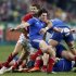 Maxime Machenaud of France struggles with Mike Phillips of Wales during their Six Nations rugby match against France at the Stade de France in Saint-Denis near Paris
