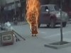 FILE - In this file image taken from Nov. 11, 2011 video footage released by Students For A Free Tibet via AP video purports to show Buddhist nun Palden Choetso engulfed in flames in her self-immolation protest against Chinese rule on a street in Tawu, Tibetan Ganzi prefecture, in China's Sichuan Province. Dozens of Tibetans have set themselves on fire over the past year to protest Chinese rule, sometimes drinking kerosene to make the flames explode from within, in one of the biggest waves of political self-immolations in recent history. (AP Photo/Students For A Free Tibet via AP video, File)