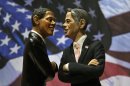 Two statuettes depicting President Barack Obama, left, and Republican rival Mitt Romney are backdropped by the Stars and Stripes in a shop which sells Christmas nativity figures in Naples, Italy, Monday, Oct. 22, 2012, hours ahead of their third and final presidential debate in Boca Raton, Florida. (AP Photo/Salvatore Laporta)