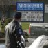 A Bremerton Police officer stands watch at an entrance to Armin Jahr Elementary School, Wednesday, Feb. 22, 2012, in Bremerton, Wash. A girl was shot in the abdomen at the school and airlifted to Seattle’s Harborview Medical Center. (AP Photo/Ted S. Warren)