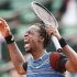 Monfils of France reacts during his men's singles match against Berdych of Czech Republic at the French Open tennis tournament in Paris