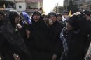 Relatives mourn during the funeral of Hasan Faisal Sheker, an 18-year-old Hezbollah member, in Nabi Sheet near Baalbeck