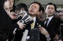 Tokyo Governor Naoki Inose is surrounded by media as he speaks to reporters at Tokyo Metropolitan Government headquarters in Tokyo