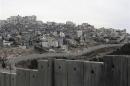 Israel's controversial barrier runs along the Shuafat refugee camp in the West Bank near Jerusalem
