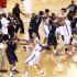 DELETES NAME FROM BYLINE IN HEADER FIELD - Players of the Georgetown University men's basketball team and China's Bayi Rockets fight during their exhibition game in Beijing, China, Thursday, Aug. 18, 2011. The bench-clearing brawl at the exhibition game between American and Chinese basketball teams marred the orchestrated harmony of U.S. Vice President Joe Biden's visit to China. The fight forced the game to end early. (AP Photo/CD-ANPF)