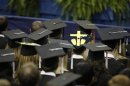 A student wears a mortorboard with a symbol for an aborted fetus, during commencement address by U.S. President Barack Obama at the University of Notre Dame in South Bend