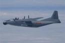A Chinese military plane Y-8 airborne early warning plane flies through airspace between Okinawa prefecture's main island and the smaller Miyako island in southern Japan