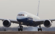 <p>               FILE - In this Jan. 20, 2012 file photo, a Boeing 787 comes in for a landing at McConnell Air Force Base in Wichita, Kan. Fourth-quarter profits at Boeing jumped 20 percent as it delivered more planes. The strength in its commercial airplane unit helped to offset a flat quarter in defense.  (AP Photo/The Wichita Eagle, Travis Heying, File)