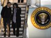 President Barack Obama and first lady Michelle Obama walk off Air Force One after arriving at O'Hare International Airport in Chicago, Tuesday, Nov. 6, 2012. (AP Photo/Paul Beaty)