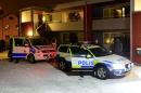 Swedish police guard a temporary shelter for asylum seekers in Boliden