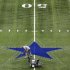Dallas Cowboys field supervisor Chris Morrow paints the star on the 50-yard line at the Alamodome in San Antonio, Texas on Monday, July 25, 2011. (AP Photo/The San Antonio Express-News, Edward A. Ornelas)  RUMBO DE SAN ANTONIO OUT; NO SALES