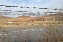 A barbed-wire fence separating North Korea from China is seen in this photo taken from the Chinese border city of Hunchun