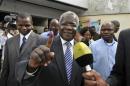 Mozambique's opposition RENAMO Presidential candidate Afonso Dhlakama shows an ink dyed finger after voting in the country's Presidential, Parliamentary and Provincial Elections in Maputo