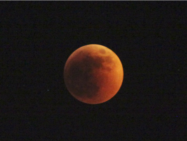 The moon turns red  during total Lunar Eclipse of the moon seen in Nairobio, Kenya, June 15, 2011. Asian and African night owls were treated to a lunar eclipse, and ash in the atmosphere from a Chilea