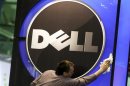 A man wipes logo of Dell IT firm at CeBIT exhibition centre in Hannover