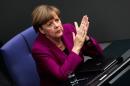 German Chancellor Angela Merkel sits on her chair prior to her so called 'Government Declaration' speech ahead of the G7 summit in front of the German parliament Bundestag in Berlin, Wednesday, June 4, 2014. (AP Photo/Markus Schreiber)