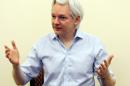 Wikileaks founder Julian Assange speaks to the media inside the Ecuadorian Embassy in London on June 14, 2013