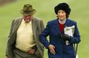 Henrietta Knight (R) and Terry Biddlecombe (L), owners of Best Mate walk the course before The Cheltenham Gold Cup Steeple Chase on March 18, 2004