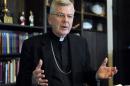 Archbishop John Nienstedt talks with a reporter
