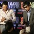 Filipino boxing icon and Congressman Manny "Pacman" Pacquiao, right, and Mexican boxer Juan Manuel Marquez sign their autograph on boxing gloves after a press conference for the kick-off of their World Press Tour Saturday, Sept. 3, 2011 at the Manila Hotel, Philippines, to promote their fight on Nov. 12 in Las Vegas, USA. (AP Photo/Pat Roque)