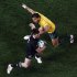New Zealand All Blacks' Cory Jane avoids the tackle of Australia Wallabies' Digby Ioane during their Rugby World Cup semi-final match at Eden Park in Auckland