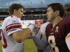 Washington Redskins quarterback Rex Grossman, right, greets New York Giants quarterback Eli Manning after an NFL football game in Landover, Md., on Sunday, Sept. 11, 2011. The Redskins defeated the Giants 28-14. (AP Photo/Susan Walsh)