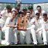 Australia's team members pose for photographers with the Warne-Muralitharan Trophy after they beat Sri Lanka in their third cricket test match at the Sydney Cricket Ground