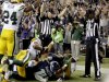 Officials signal a touchdown by Seattle Seahawks wide receiver Golden Tate, obscured, on the last play of an NFL football game against the Green Bay Packers, Monday, Sept. 24, 2012, in Seattle. The Seahawks won 14-12. (AP Photo/Stephen Brashear)