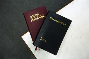 Picture illustration shows two copies of the Bible in Malay and the Iban dialect