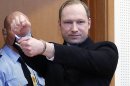 FILE - In this Feb. 6, 2012 file photo, Anders Behring Breivik, a right-wing extremist who confessed to a bombing and mass shooting that killed 77 people on July 22, 2011, gestures as he arrives for a detention hearing at a court in Oslo, Norway. Breivik is not criminally insane, a psychiatric assessment found Tuesday, April 10, 2012 contradicting an earlier assessment. The new conclusion comes just six days before Breivik is scheduled to go on trial on terror charges for the massacre on July 22. (AP Photo/Heiko Junge, Scanpix Norway, File) NORWAY OUT