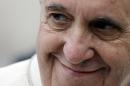 Pope Francis smiles as he leaves St. Peter's Square at the end of the weekly general audience at the Vatican, Wednesday, Oct. 9, 2013. (AP Photo/Gregorio Borgia)
