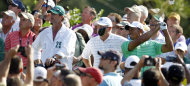 Tiger Woods watches his tee shot from the 15th hole during a practice round for the Masters golf tournament Wednesday, April 4, 2012, in Augusta, Ga. (AP Photo/Chris O'Meara)