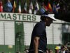 Phil Mickelson walks past a scoreboard while walking up the ninth hole during a practice round for the Masters golf tournament Tuesday, April 9, 2013, in Augusta, Ga. (AP Photo/Charlie Riedel)
