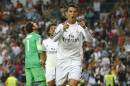 Real's Cristiano Ronaldo, foreground celebrates his goal during a Spanish La Liga soccer match between Real Madrid and Athletic Bilbao at the Santiago Bernabeu stadium in Madrid, Spain, Sunday, Oct. 5, 2014. (AP Photo/Andres Kudacki)