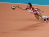 China's Zhang Xian tries to save a spike by South Korea during the women's volleyball final at the 16th Asian Games in Guangzhou