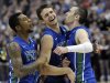 Florida Gulf Coast's Dajuan Graf, from left, Eddie Murray and Brett Comer celebrate after winning a third-round game against San Diego State in the NCAA college basketball tournament, Sunday, March 24, 2013, in Philadelphia. Florida Gulf Coast won 81-71. (AP Photo/Michael Perez)