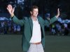 Adam Scott of Australia celebrates with his green jacket after winning the 2013 Masters golf tournament in Augusta