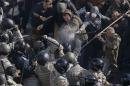 Radical protesters clash with law enforcement members on the Day of Ukrainian Cossacks during a rally near the parliament building in Kiev
