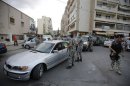 Lebanese security forces man a checkpoint in the southern suburb of the capital Beirut on September 23, 2013